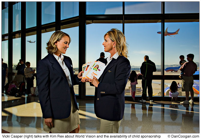 Vicki Casper (right) talks with Kim Rex (both with Southwest Airlines) about World Vision and the availability of child sponsorship