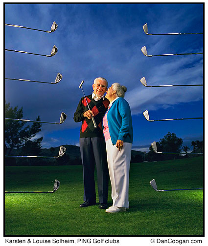 Karsten & Louise Solheim, Karsten Manufacturing, PING golf equipment, stands with 12 golfclubs surrounding then in mid air