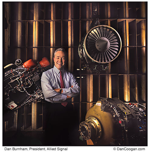 Dan Burnham, President, Allied Signal Aerospace, stands in a jet engine test cell
