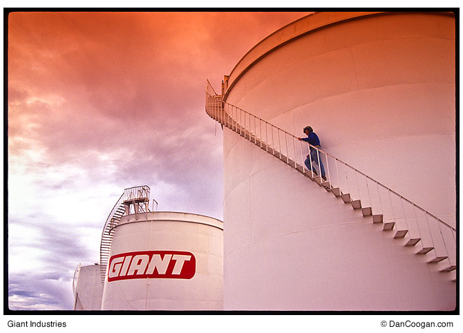 Giant Industries, refinery worker climbing fuel tank stairs