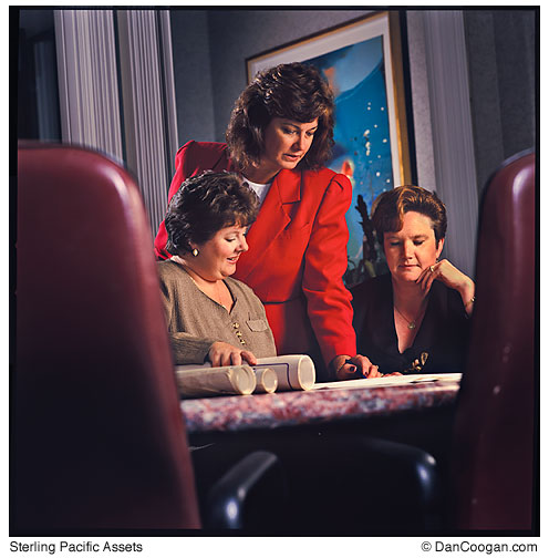 Sterling Pacific Assets, Conference room, three women discussing architectural plans